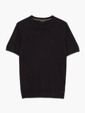 A man wearing a black knit T-Shirt with ribbed short sleeves, a crew neckline and a regular fit.