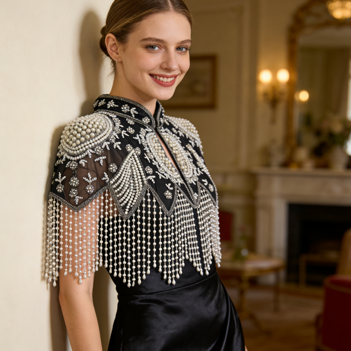 Luxury black and ivory bridal shoulder cape featuring faux pearl embroidery and elegant fringe.