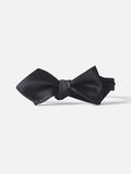 Black satin diamond-point bow tie with glossy finish laid flat on a white background