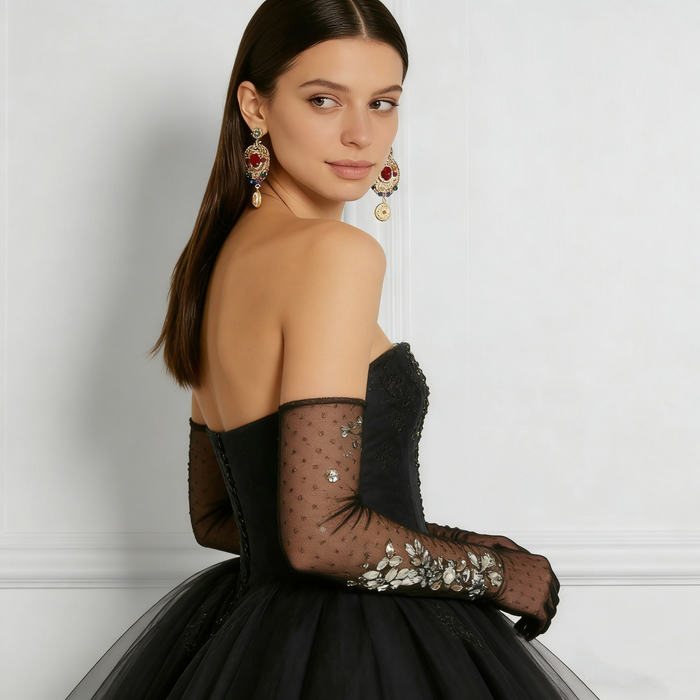Black tulle opera gloves featuring hand sewn crystal rhinestone floral embellishments with sheer mesh design.