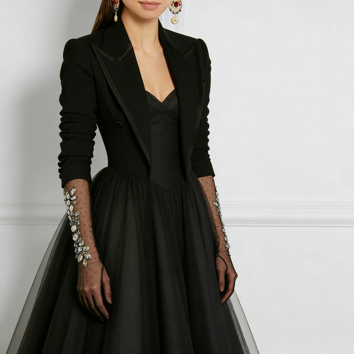 Black tulle opera gloves featuring hand sewn crystal rhinestone floral embellishments with sheer mesh design.