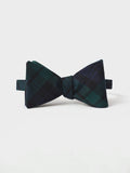 Black watch tartan bow tie, tied, on a white background.