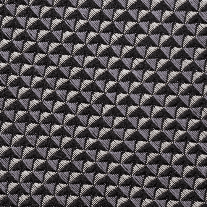 Close-up of black-and-pewter woven diamond texture on silk necktie fabric.