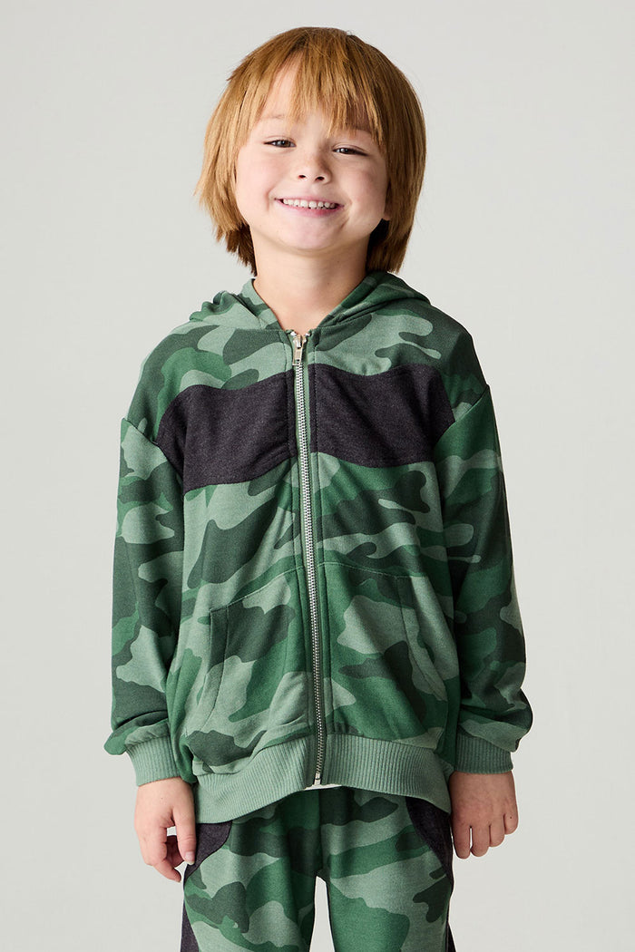 Font view of a boy wearing the Chaser Blocked Camo Boys Hoodie on a neutral background with matching pants