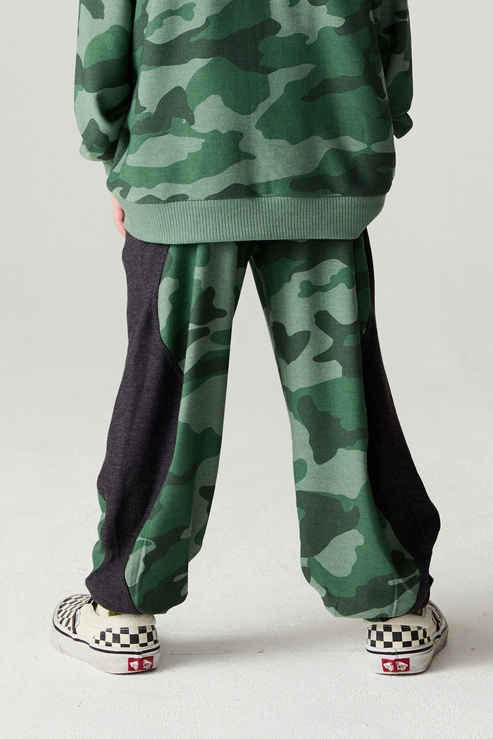 Back view of a boy wearing the Chaser Blocked Camo Pants Boys Jogger on a neutral background
