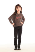 Full body view of girl wearing Chaser’s Blondie Leopard & Hearts print pullover top with red text and black pants on a white background