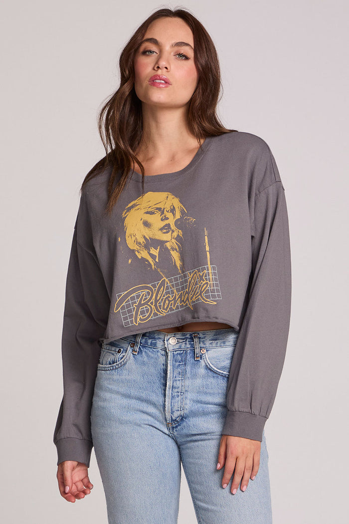 Front view of a woman wearing the Chaser Blondie Live Cropped Sweatshirt on a neutral background