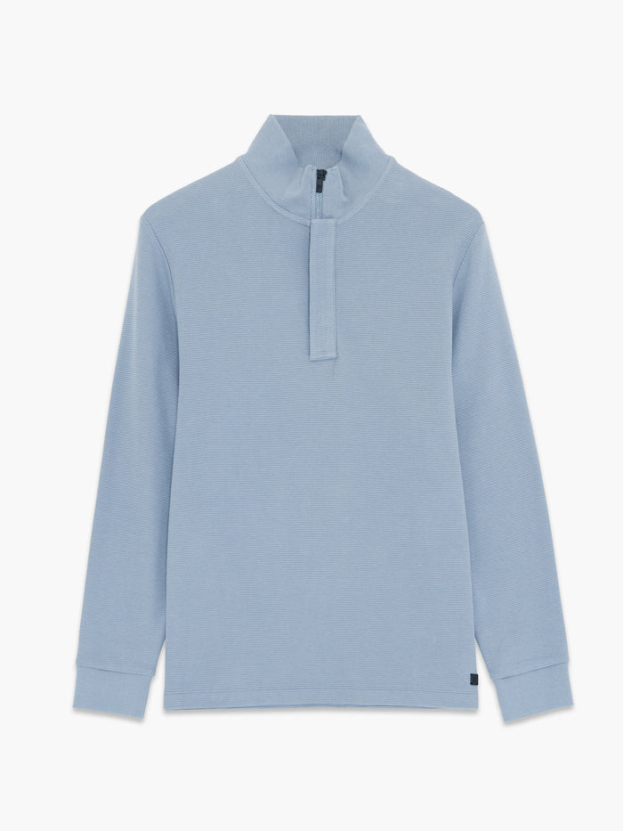 A man wearing a blue Sweatshirt with long sleeves, a funnel neckline, a branded half zip and a regular fit.