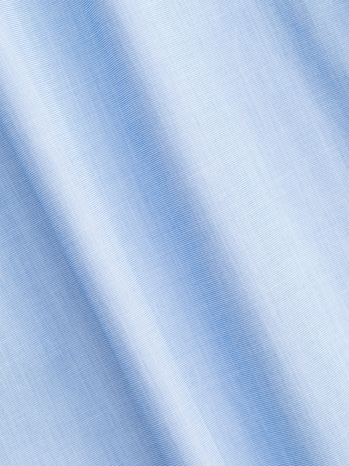 Close-up of light blue stretch cotton dress shirt fabric texture.