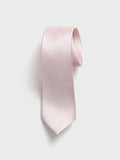 Blush silk necktie with twill texture, rolled at the top, on a grey background.