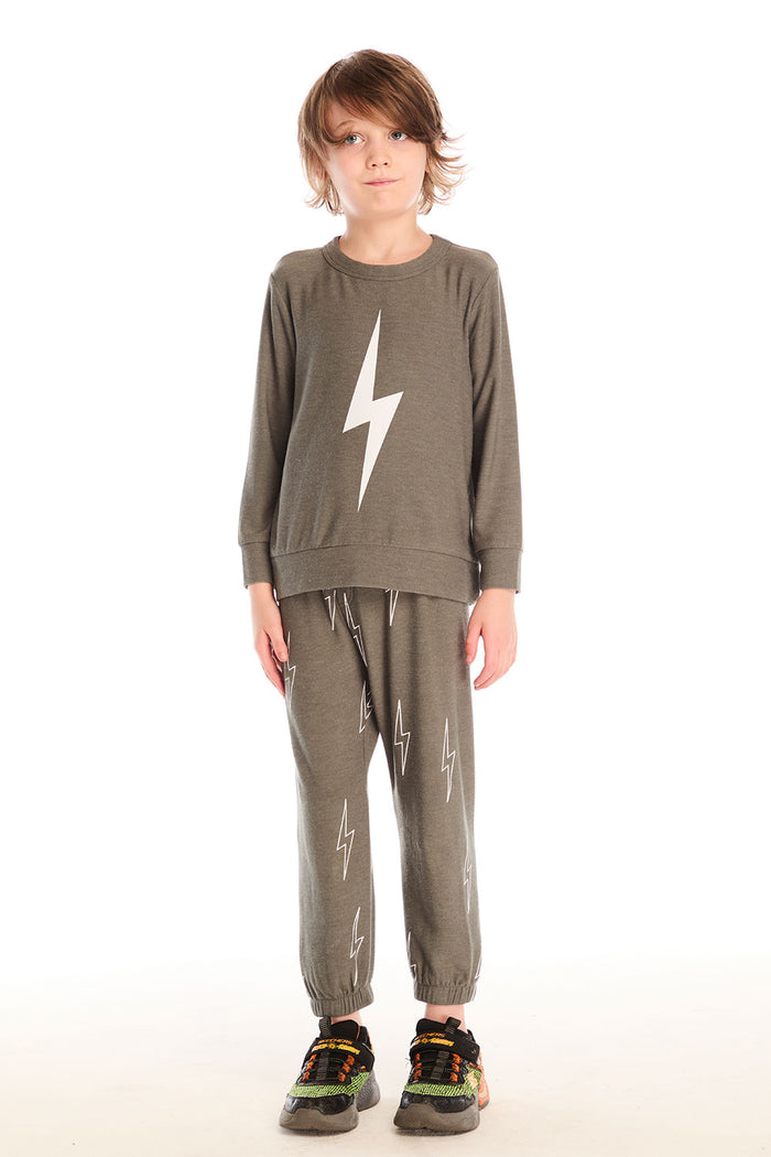 Full body view of boy wearing Chaser’s Bolt safari green long sleeve top with lightning bolt design and matching pants on a white background.