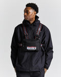 Person wearing a black jacket and bag with 'HOODRICH' branding, on a white background.