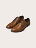 Pair of brown leather derby shoes, angled side view with laces and stacked heel.