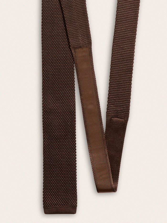 Back of a brown silk knit tie showing the keeper loop and tail.
