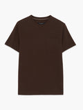 A man wearing a brown cotton textured T-Shirt with short sleeves, a crew neckline, 1 patch chest pocket and a regular fit.