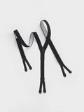 Black button suspenders laid flat on a white background.