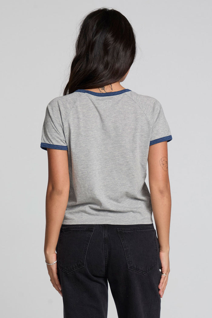 Back view of a woman wearing the Chaser California Dreamin Tee and pants on a neutral background