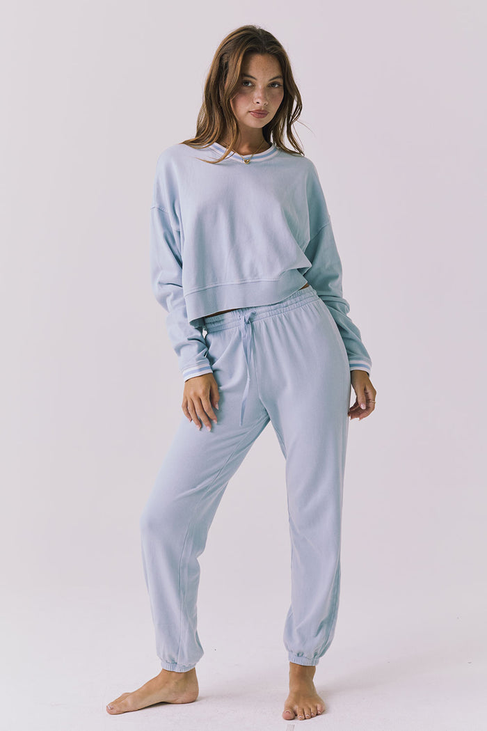 Chaser Campbell Bluebird Pullover styled full body with matching Willa Joggers in Bluebird for a coordinated lounge set look