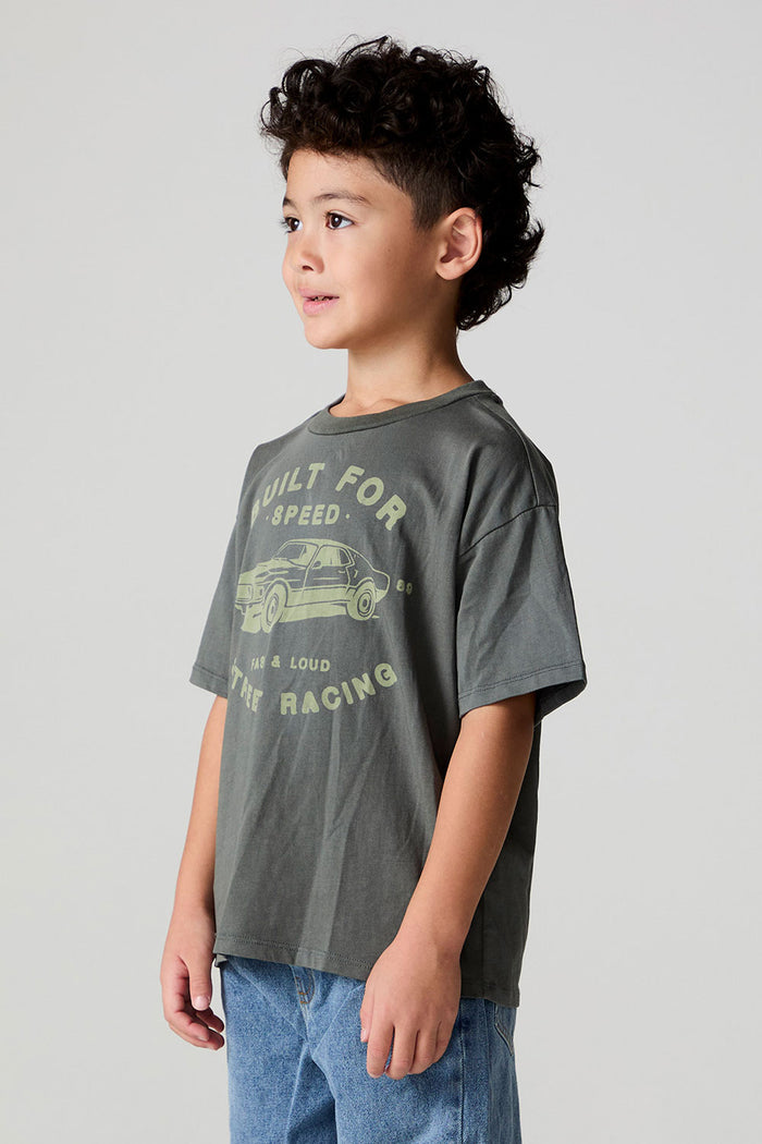 Side view of a boy wearing the Chaser  Car Show Tee on a neutral background