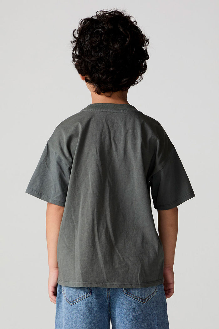Back view of a boy wearing the Chaser  Car Show Tee on a neutral background