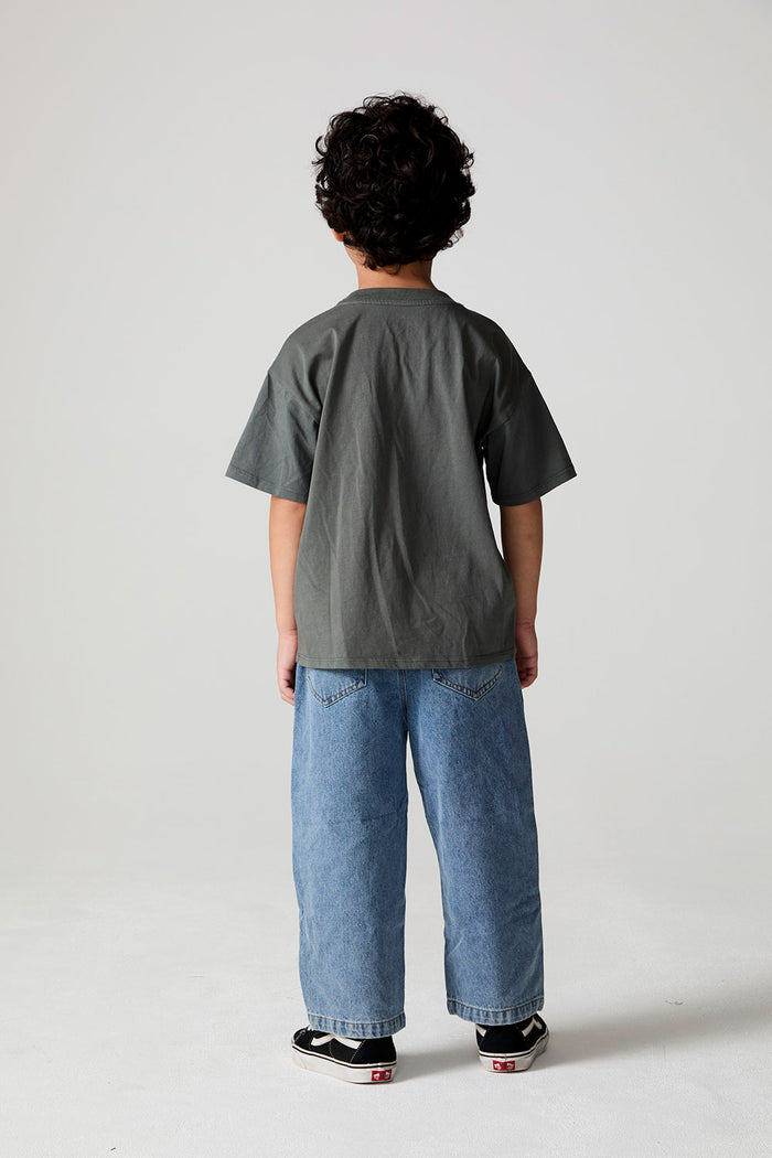 Full body back view of a boy wearing the Chaser  Car Show Tee on a neutral background