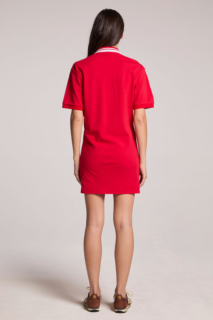 Back view of a woman wearing the Chaser Cardinal Red Carlo Mini Dress on a neutral background