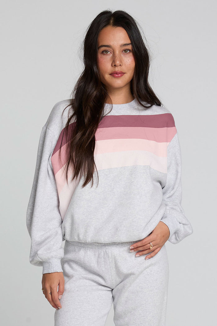 Front view of a woman wearing the Chaser  Cashbah Heather Grey Pullover on a neutral background