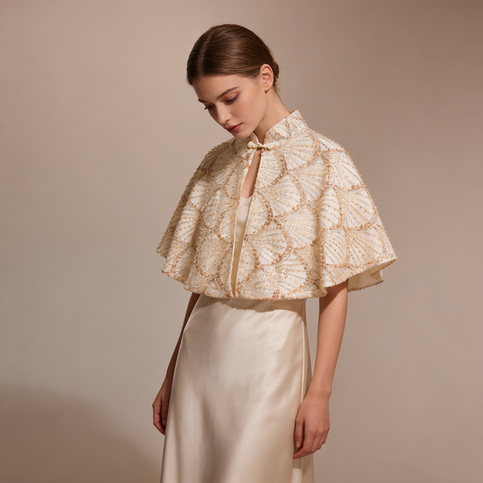 Elegant bridal shoulder cape featuring shimmering sequins and handcrafted bead embroidery.