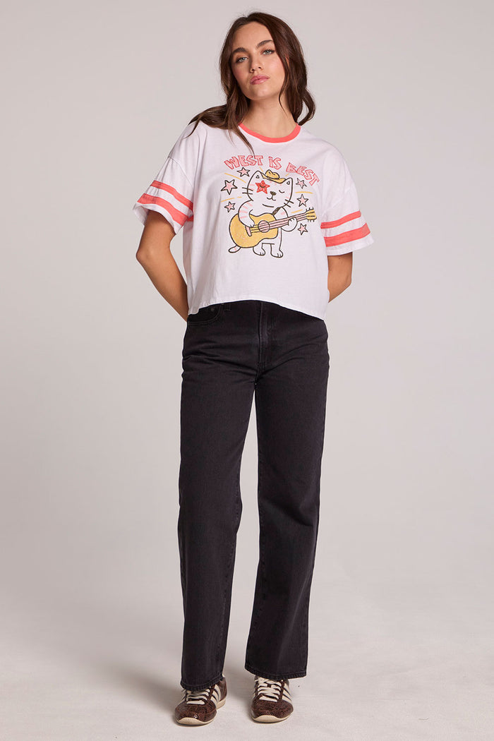 A full body front view of a woman wearing the Chaser Teddy Tee on a neutral background