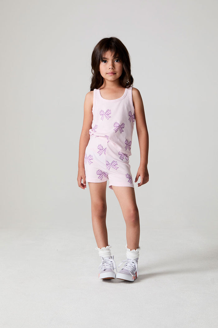 Full body front view of a girl wearing the Chaser Check Bow Shorts on a neutral background