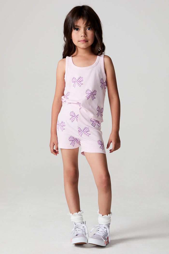 Full body front view of a girl wearing the Chaser Check Bow Shorts and tank on a neutral background