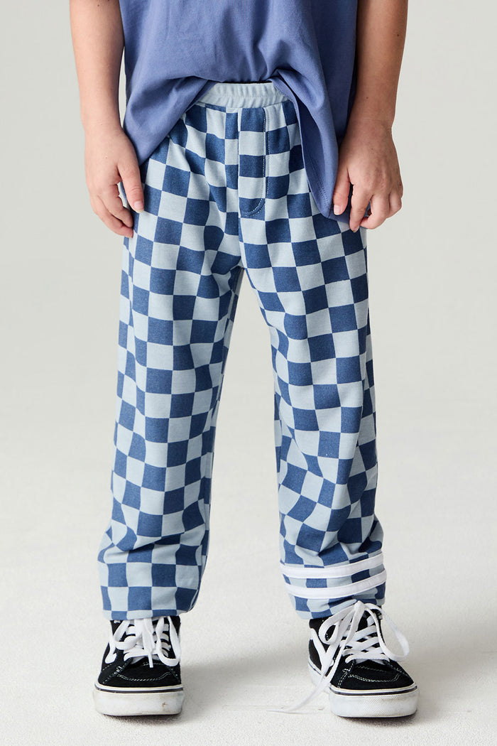 Front view of a boy wearing the Chaser  Checkered Pants Boys Jogger on a neutral background with matching shirt