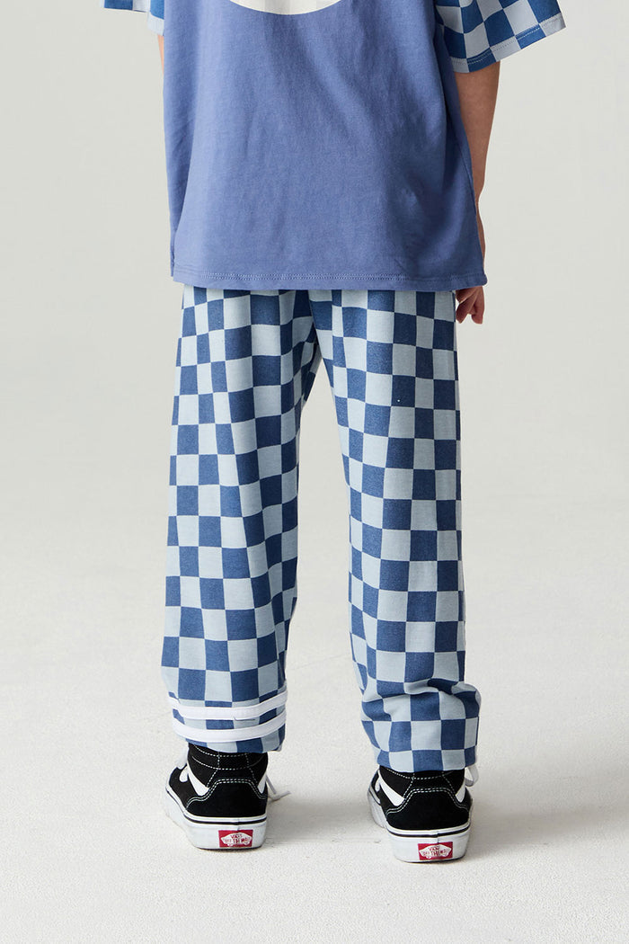 Back view of a boy wearing the Chaser  Checkered Pants Boys Jogger on a neutral background with shirt