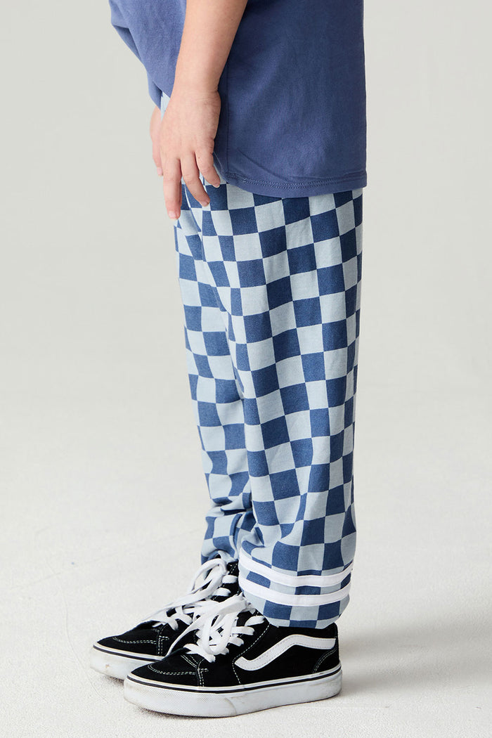 Side view of a boy wearing the Chaser  Checkered Pants Boys Jogger on a neutral background