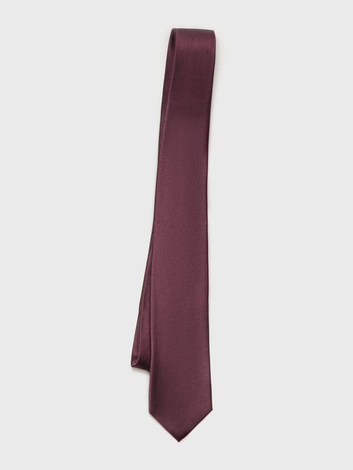 Chianti silk necktie with twill texture, draped diagonally on a grey background.
