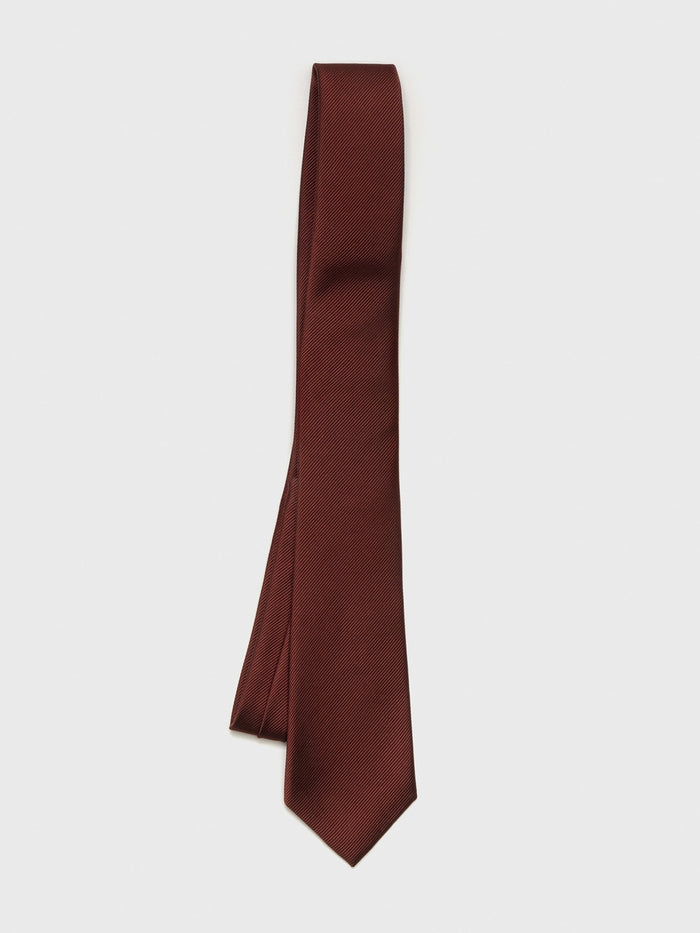 Cinnamon silk necktie with a textured weave, hanging against a white background.