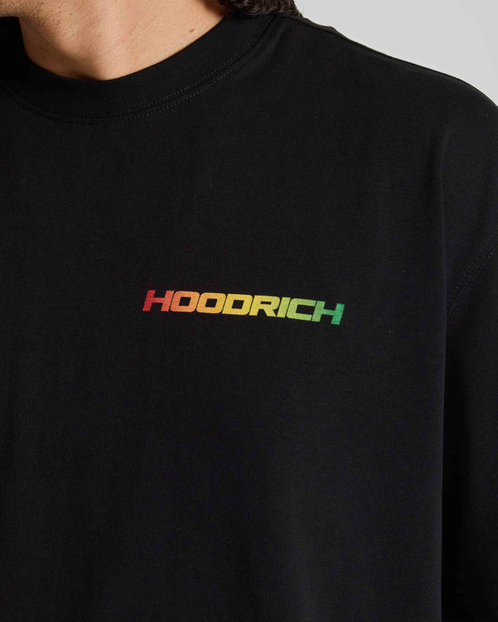 Close-up of a person wearing a black crewneck sweatshirt with the brand name 'HOODRICH' printed across the chest in a rainbow gradient.