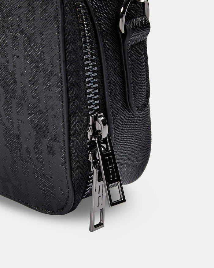 Black textured bag with a zipper on a light gray background