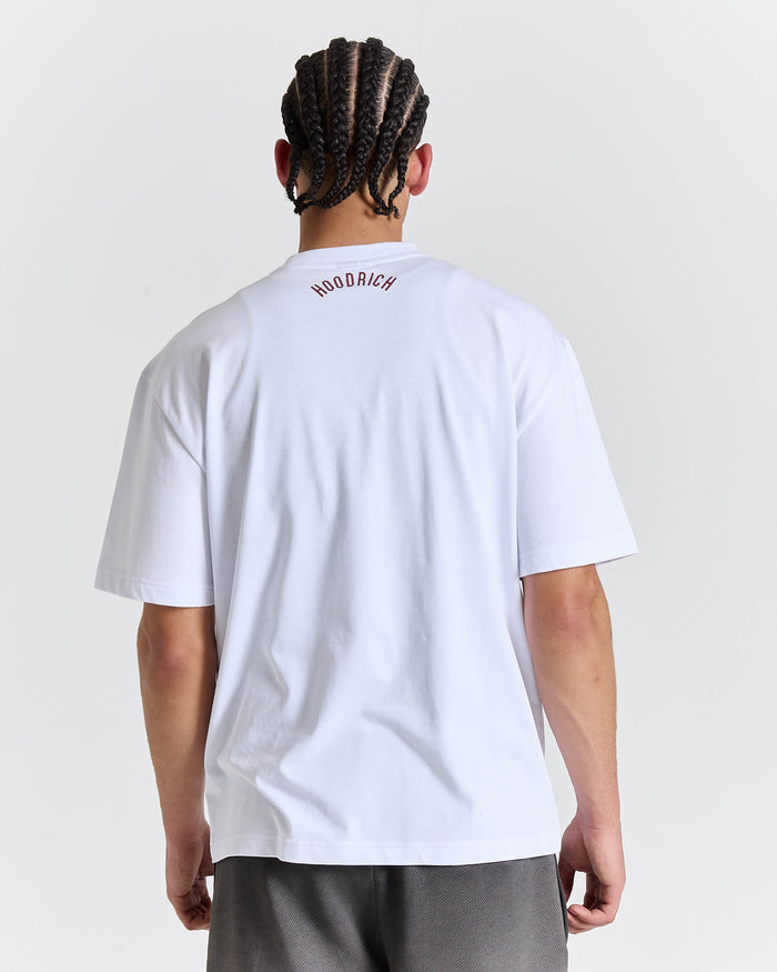Person wearing a white t-shirt with 'Woodrich' branding on the back, standing against a plain background.