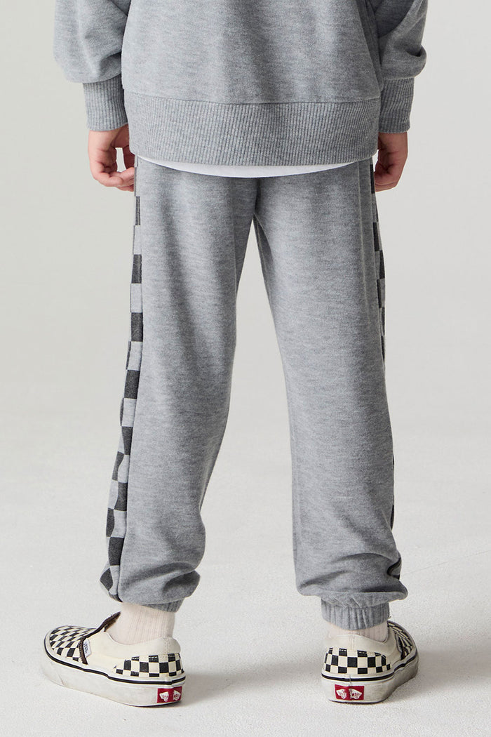 Back view of a boy wearing the Chaser Color Block Heather Grey Barrel Leg Pants on a neutral background