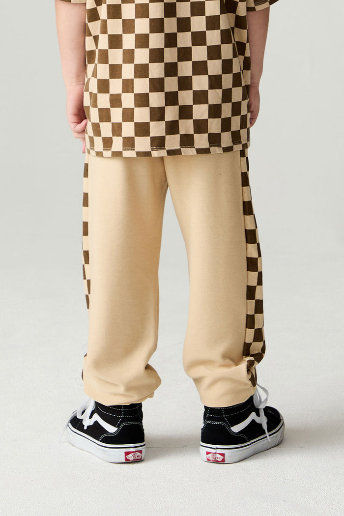 Back view of a boy wearing the Chaser Color Blocked Jogger on a neutral background
