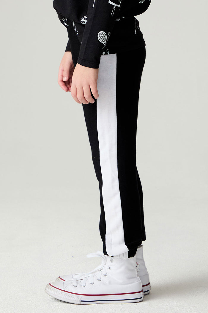 Side view of a boy wearing the Chaser Blocked Lounge Pants Boys Black Jogger on a neutral background with arms at sides