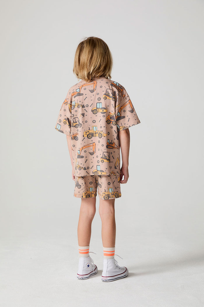 Full body back view of a boy wearing the Chaser Construction Days Tee on a neutral background