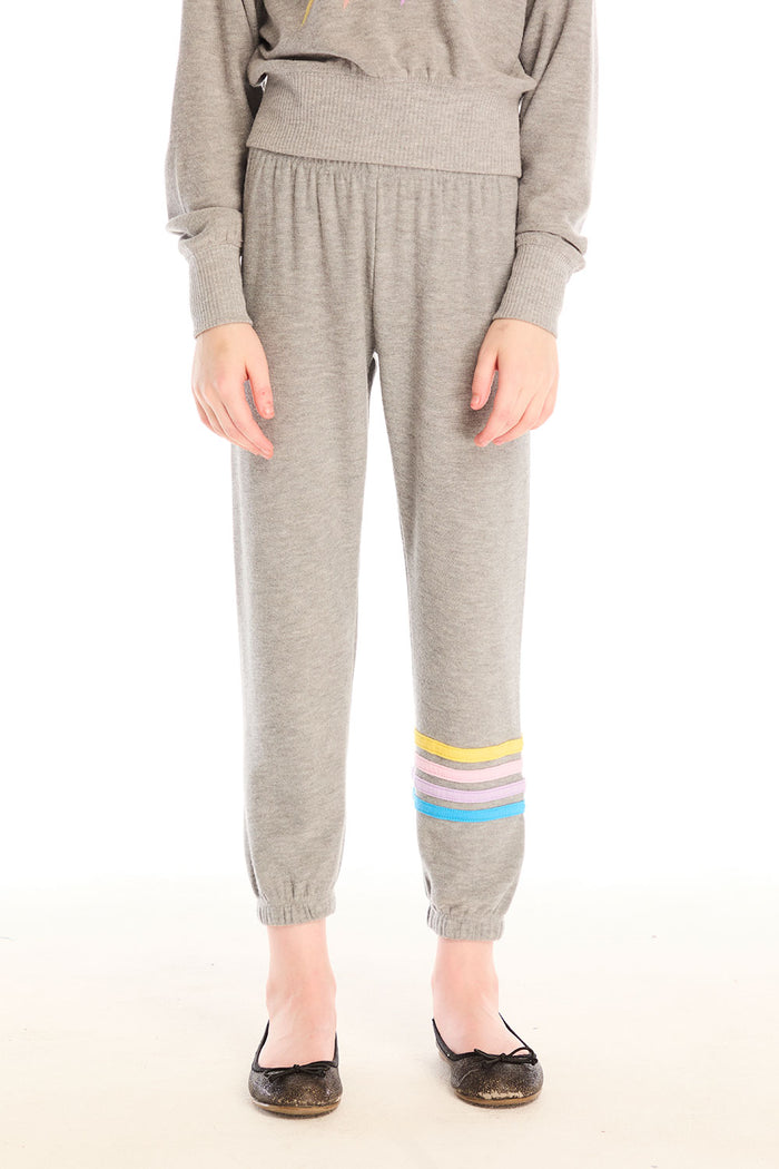 Girl wearing Chaser’s Heather Grey Contrast Strappings Pants with colorful accents on the left leg on a white background