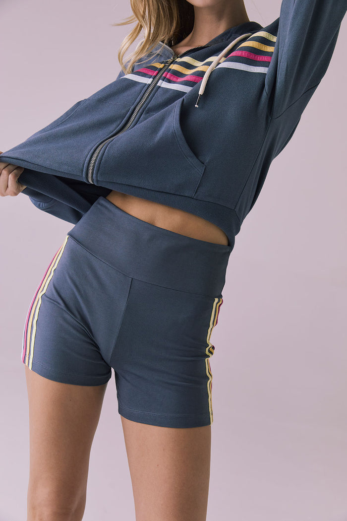 Model wearing the Chaser Contrast Strappings Shorts in Faded Grey featuring colorful contrast side stripes and a high-rise waistband