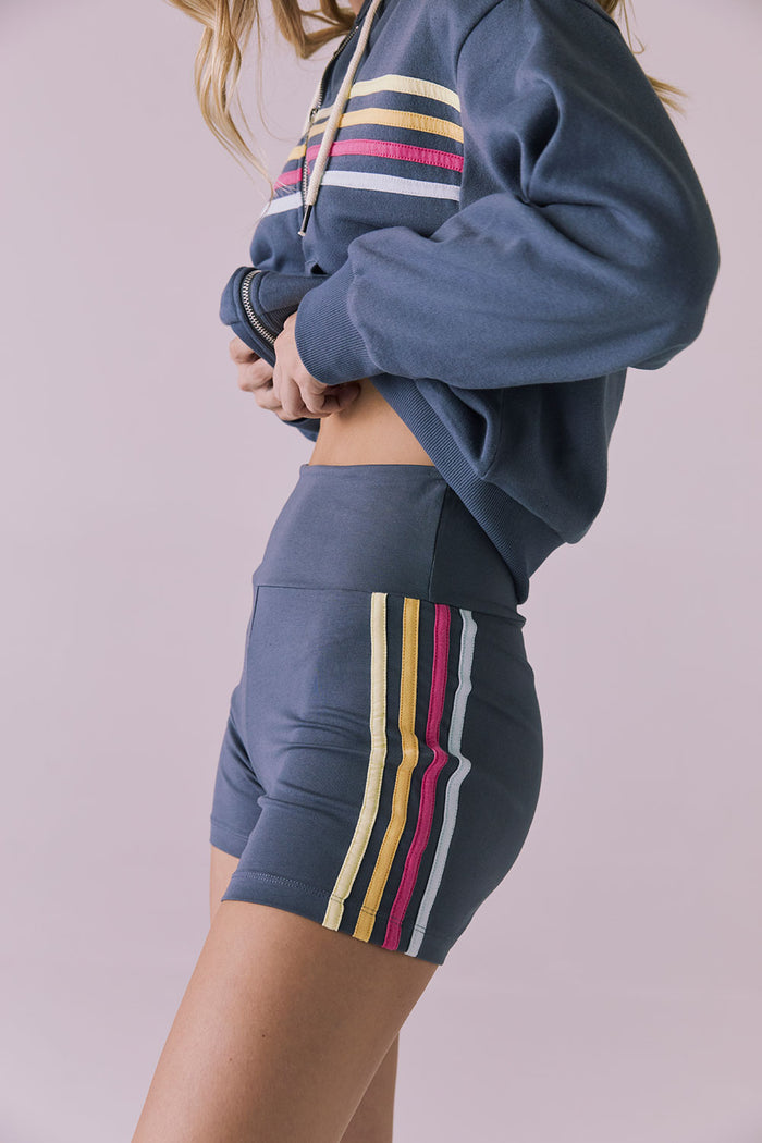 Side view of the Chaser Contrast Strappings Shorts showing the multi-stripe detail and smooth, body-hugging fit