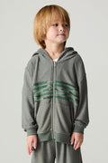 Front view of a boy wearing the Chaser Cool Camo Boys Zip Up on a neutral background and matching camo pants