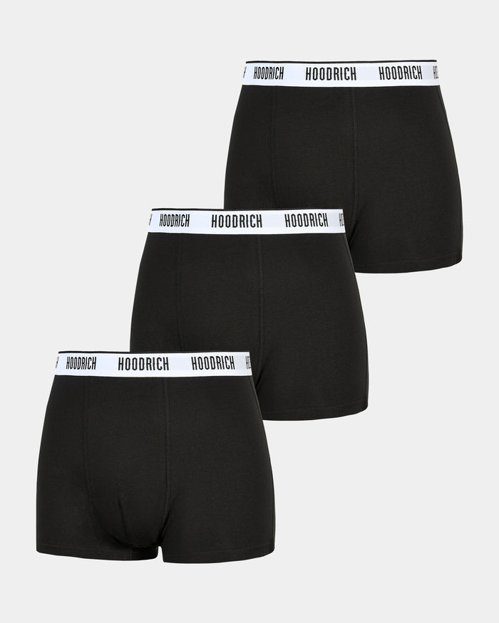 Three pack of black boxer shorts with white waistbands, each featuring a logo.