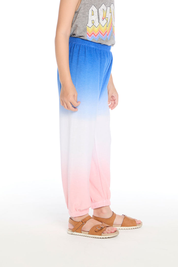 Side view of the Chaser Kids Cotton Candy Dip Dye Pants showing relaxed fit and ombré color fade on a white background
