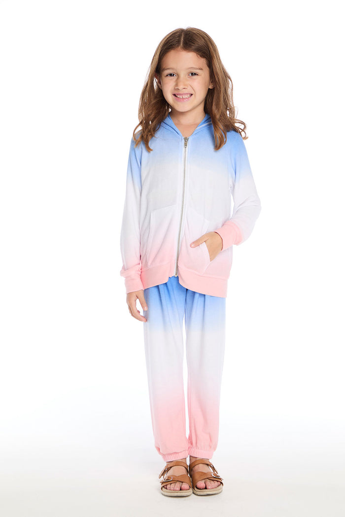 Girl wearing the Chaser Kids Cotton Candy Dip Dye Pants paired with the matching Cotton Candy Dip Dye Zip Up on a white background